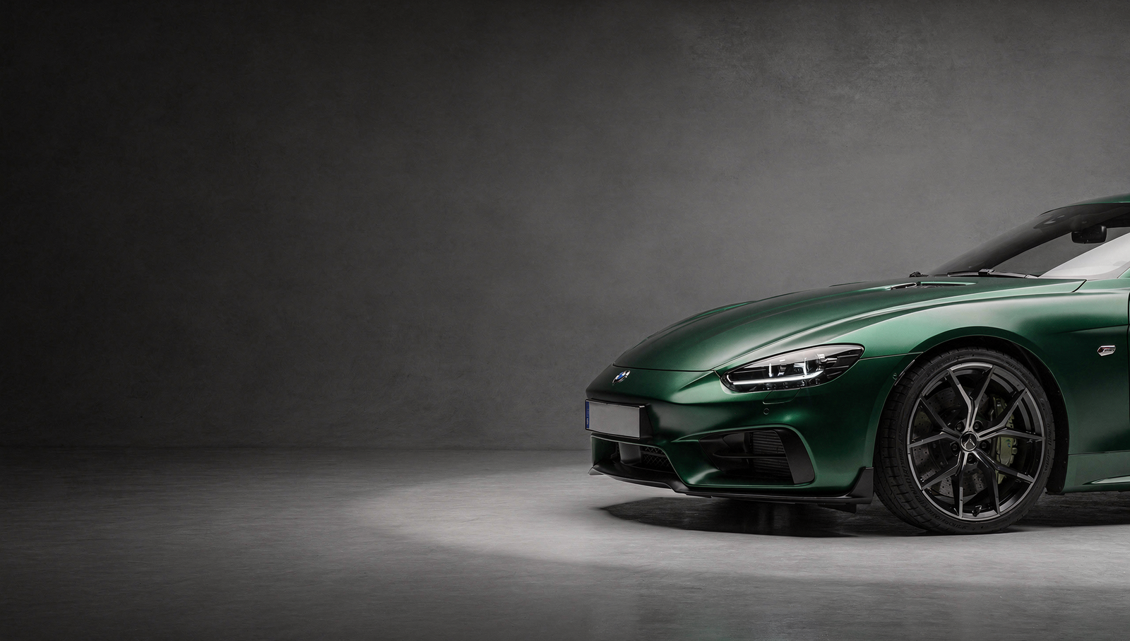 Luxury sports car finished in satin green color paint protection film